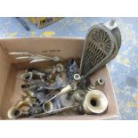 A box of assorted brassware of various ages.