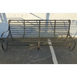 A Victorian wrought iron garden bench