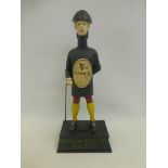 A Good For Him and Good For You Guinness cast metal money box surmounted with a figure of a man.