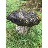 A large period stone staddle stone with top.