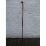 A Victorian amber glass walking stick/staff.