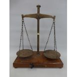 A set of 19th Century brass balance scales inscribed Avery De Grave London on one side and County of