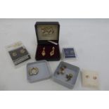 An assortment of 9ct gold earrings including singles.