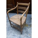 A 19th Century ash and rush seated carver armchair.