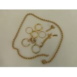 An assortment of 9ct gold jewellery including earrings and a sixteen inch gold necklace, weight 10.