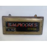 An S.W. Moores Driver in/out wall mounted brass framed plaque.