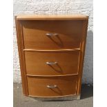 A light oak three drawer bow fronted chest.