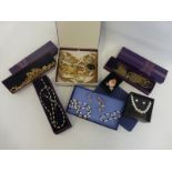 An assortment of boxed costume jewellery, various styles and makers.