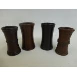 Four assorted 19th Century treen dice shakers, one with carved decoration.