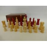 A late 19th Century full set of ivory chess pieces contained in a 19th Century mahogany lidded box.