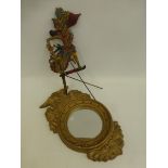 A 19th Century style gilded plaster mirror surmounted by an eagle and a decorative painted wooden