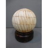 A 19th Century ribbed ball.