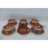 A set of six 1960s Aynsley 2832 Fruit Orchard pedestal cups and saucers.