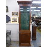 A Victorian mahogany and oak gun cabinet, the glazed upper section above a single cupboard with