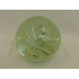 A large glass paperweight/doorstop.