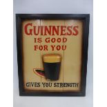 A reproduction Guinness wooden wall plaque.