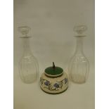 Two glass decanters with stoppers and an Art Deco ceramic A.F.C. Corneville tobbaco jar.