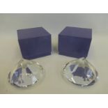 Two boxed glass diamond shaped paper weights.
