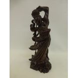 A chinese carved wooden figure of a lady dancing in pose.