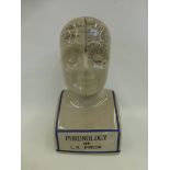 A ceramic phrenology head.