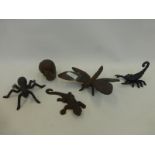 Five assorted cast metal garden insects.
