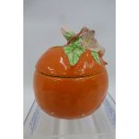 A Clarice Cliff Newport Pottery marmalade pot with apple blossom finial (small chip to finial).