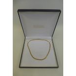 A cased 9ct gold necklace.