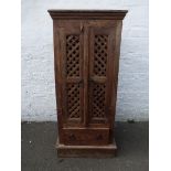 A contemporary teak cabinet with double lattice fronted doors above a single drawer base.