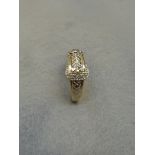 A 9ct gold gentleman's dress ring in the form of a belt, set with five diamonds to the buckle,