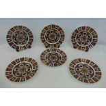 A set of six Royal Crown Derby Old Imari dinner plates all 1128 pattern, three LVIII and three LII.