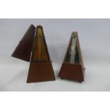 A mahogany cased metronome De Maelzel London, stamped G. Potter & Co., Aldershot, and one other.