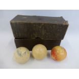 A leather cased set of three 19th Century/ early 20th Century ivory balls, the box inscribed L.