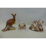 A Royal Crown Derby kangaroo with joey, gold stopper, a bull dog and a lion cub, both silver