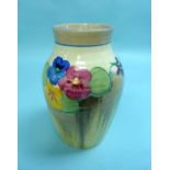 A Clarice Cliff Fantasque Bizarre 'Pansies' pattern Vase, of ribbed baluster form, printed mark, 9½