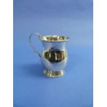 A small George V silver Mug, hallmarked Birmingham, 1925, of baluster form, with scroll handle and