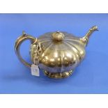 A George IV Irish silver Tea Pot, by William Nolan, hallmarked Dublin, 1829, of segmented melon