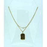 A 9ct yellow gold hinged locket of rectangular form with cut corners, with plain back and foliate