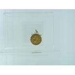 A George V gold Sovereign, dated 1912, enclosed within a 9ct gold mount with suspension ring.