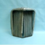 A Jaguar Mark IV Chrome Radiator Grill, 27in (69cm) high, slight dents to top, together with two