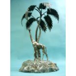 An Edwardian silver plated Centre Piece, modelled as a giraffe standing beneath a palm tree on a