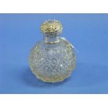 A Victorian silver mounted cut glass Scent Bottle, hallmarked Chester, 1898, of globular form, the