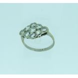 A diamond set Ring, of shaped oval form, pave set with nine diamonds, c. 2ct, all mounted in 18ct