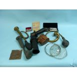 Motoring Memorabilia; a selection of car horns, Austin petrol tank caps, two headlight glasses and a