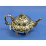 A George IV silver Teapot, hallmarked London, 1825, of segmented melon form, with leaf capped handle