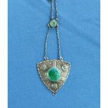 An attractive Charles Horner Pendant, the pendant of shield shape and textured surface with green/