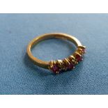 A small ruby and diamond Ring, the front set diagonally with four pale rubies with two small diamond