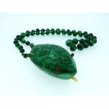 A Malachite graduated Bead Necklace, set with two small green glass beads between each one, 23in (