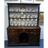 A Georgian oak Dresser, the open plate rack set on a base with rectangular top above five drawers