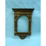 An antique ecclesiastical carved and painted wood Frame, with arched aperture and highlighted in