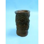 An antique Chinese carved bamboo Brush Pot, Qing dynasty, carved with figures and dog amongst trees,